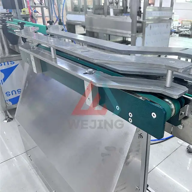 Conveyor For aerosol spray machines